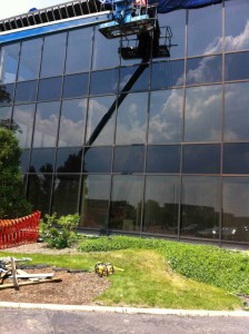 Construction workers renovating the exterior of the building.