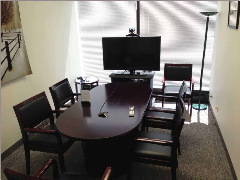 Free deposition suites in our medium-sized conference room. Video conference configuration shown.